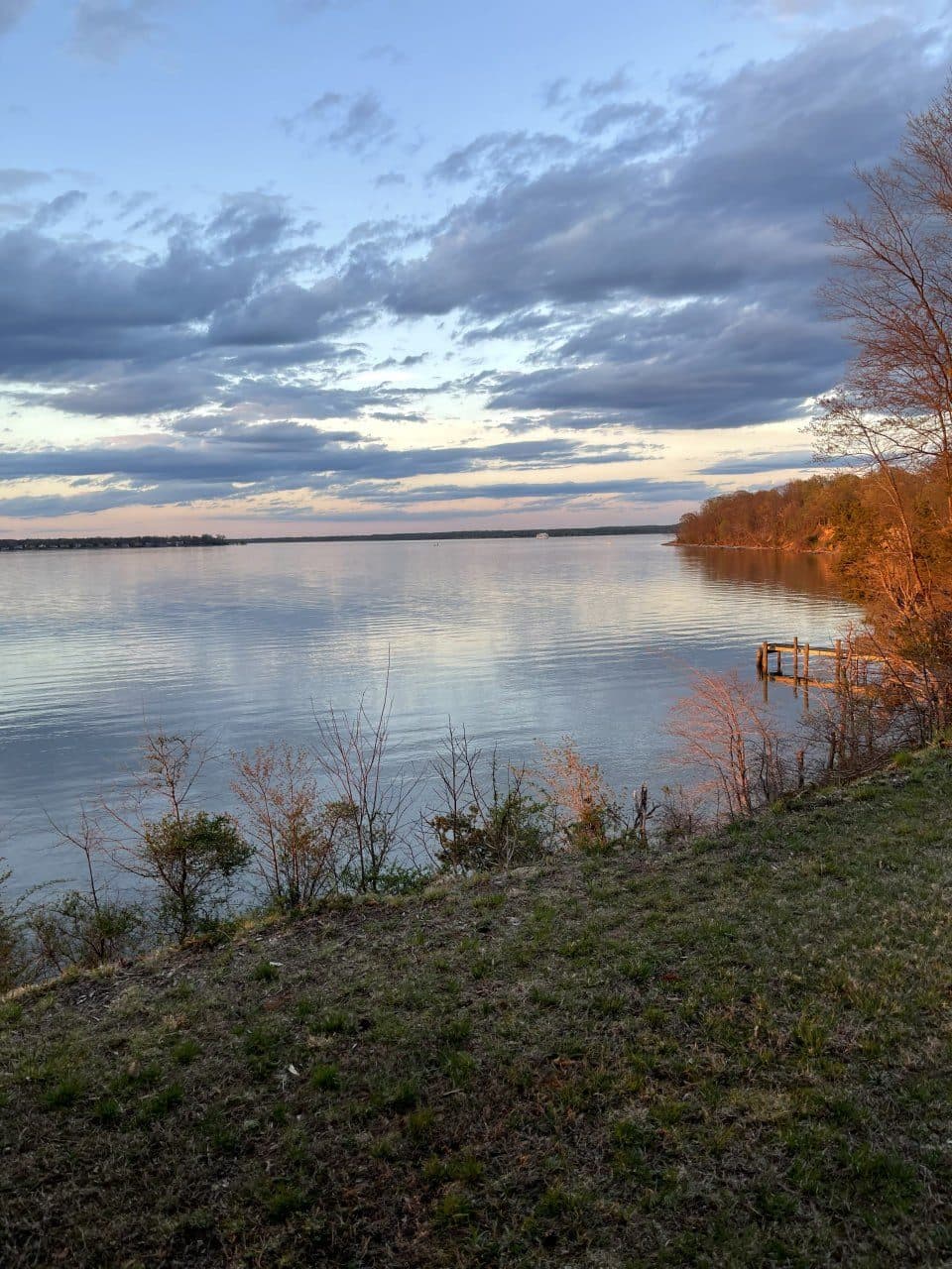 Golden hour over the Potomac River from the Stoney Point bluff, with the private dock