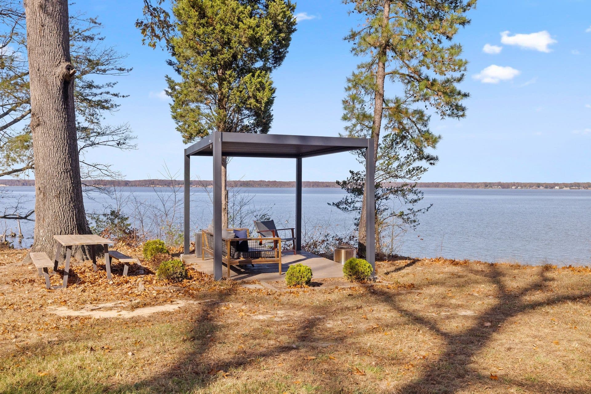 Pergola with lounge seating at the water's edge on the Potomac
